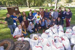 Student volunteers pick up the trash.